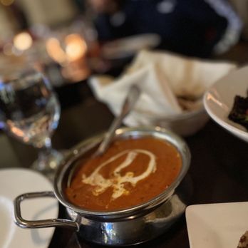 Amber India signature dishes Butter ChickenLamb VindalooBlack Lentil Dal